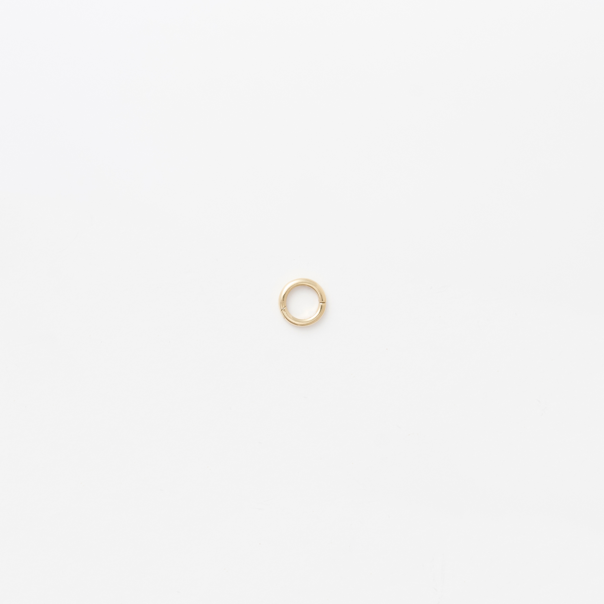 Close-up of the chubby annex link on the 14k gold belcher chain, designed to open and securely hold interchangeable pendants.