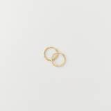 Classic gold huggie earrings with hinged click closure