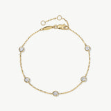 Dotted 14K gold bezel diamond station bracelet