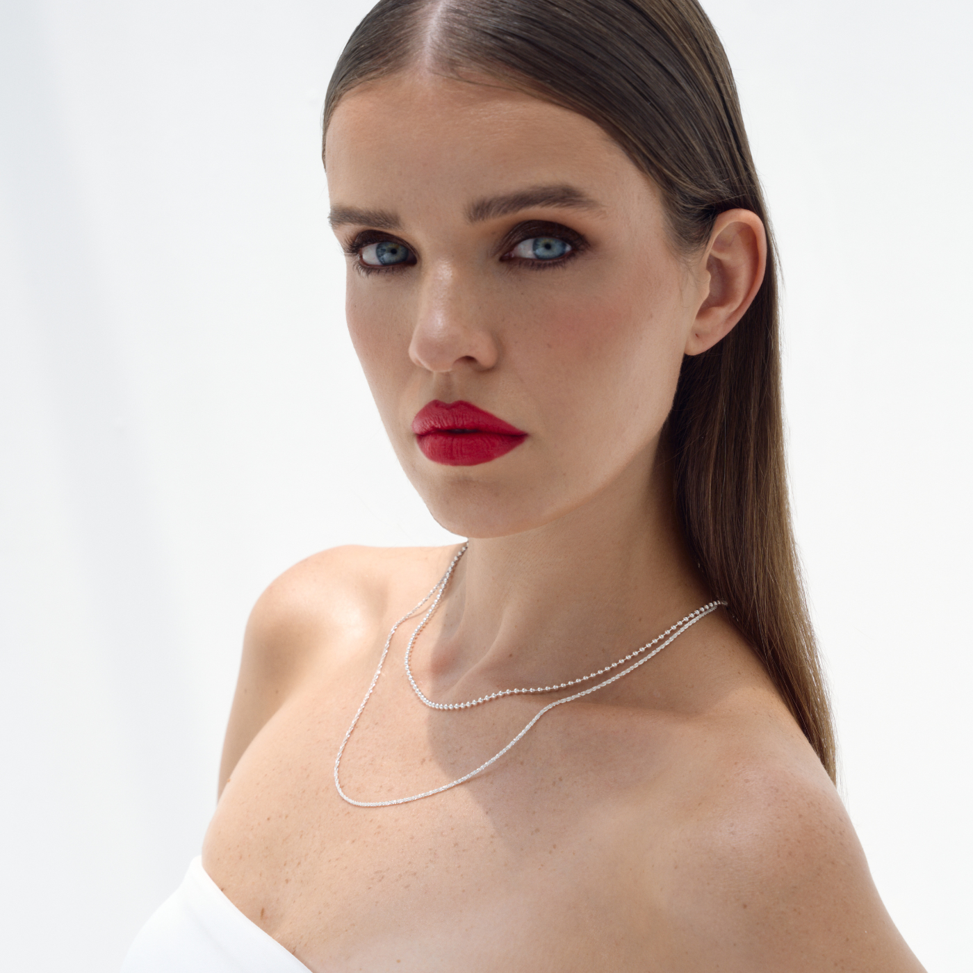 Jules sterling silver bead chain layered with necklaces