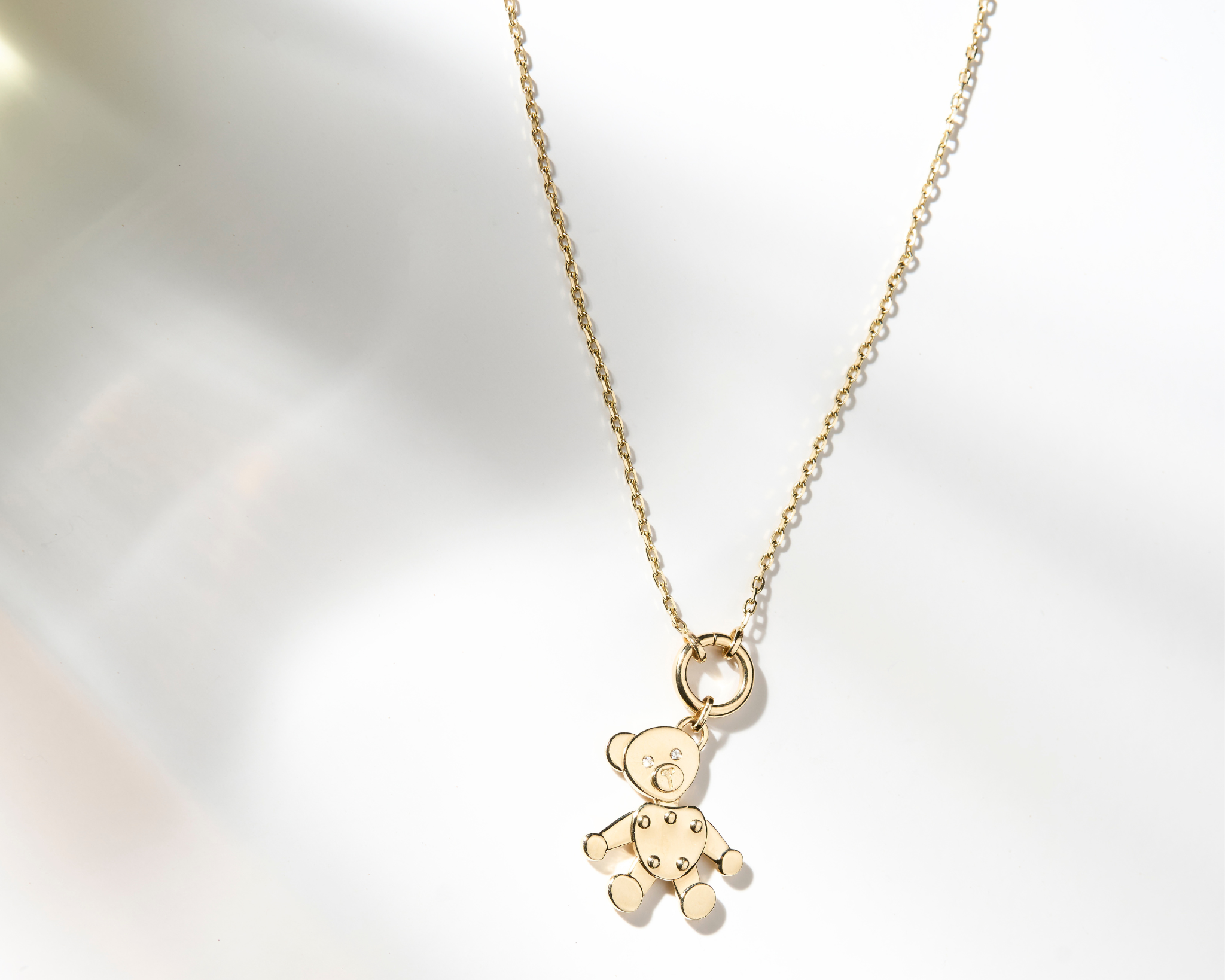 Zaerine Orso Oro bear pendant, paired with a 14k solid yellow gold open belcher chain.