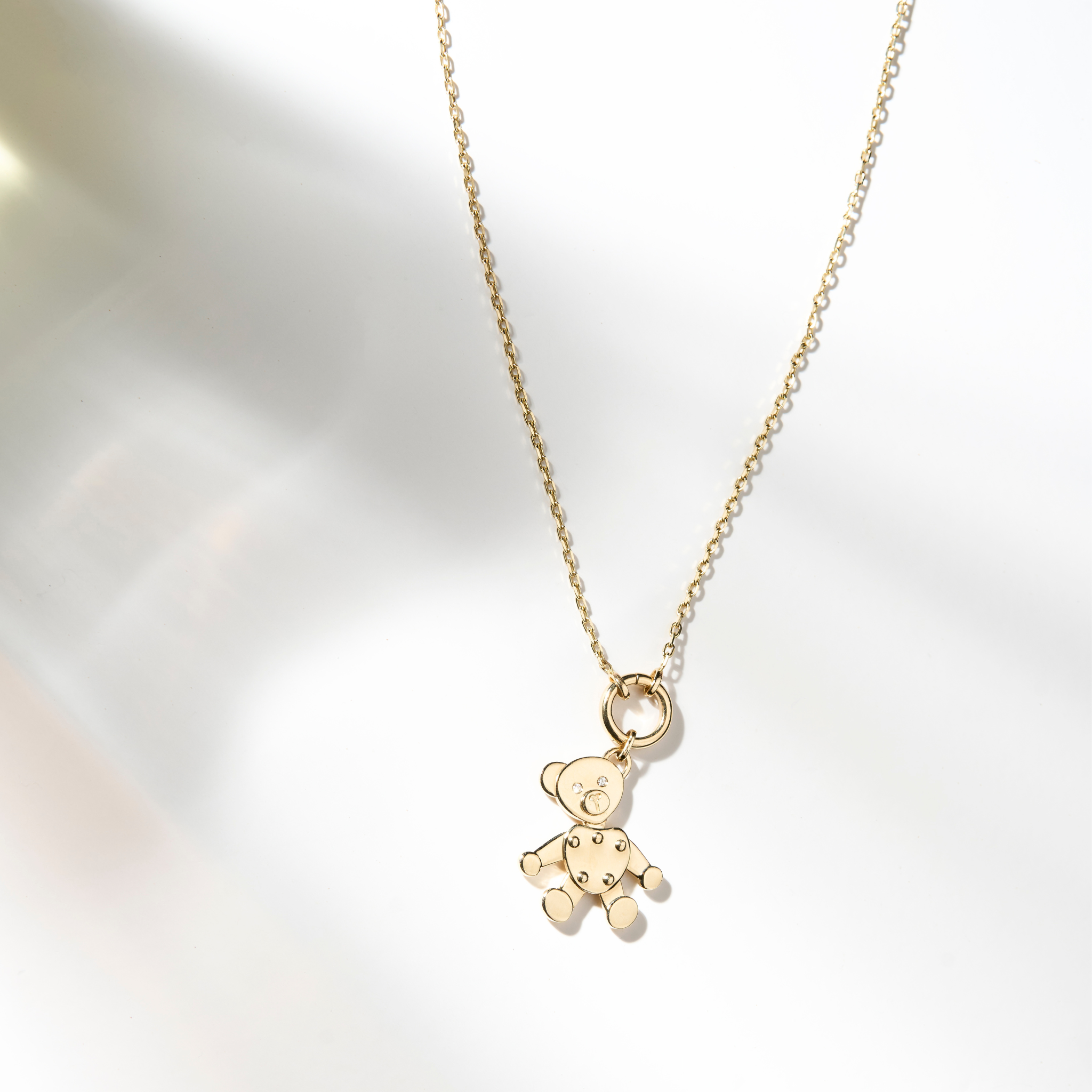 Zaerine Orso Oro bear pendant, paired with a 14k solid yellow gold open belcher chain.