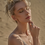 The Golden Bar Ring, styled with Zaerine's Small Leanea Earrings, Orso Oro Pendant, and Open Belcher Chain. Handcrafted in 14k solid gold, made to last.