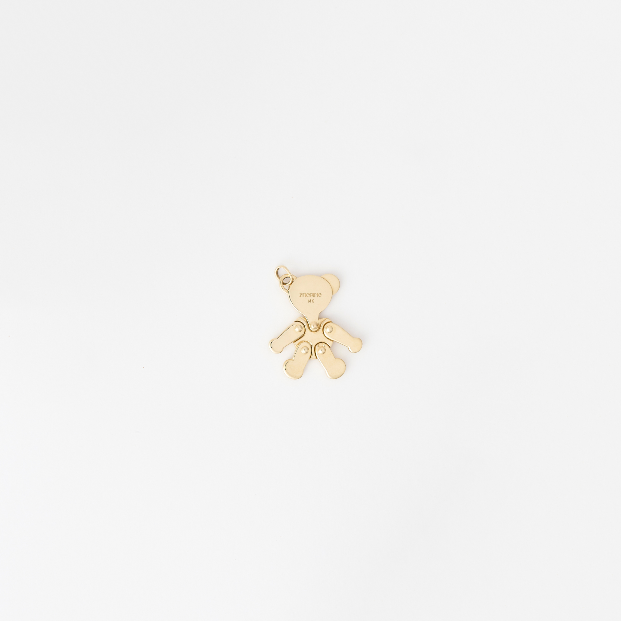 Handcrafted 14k yellow gold pendant featuring a movable head and two lab-grown diamonds, certified by the International Gemological Institute.