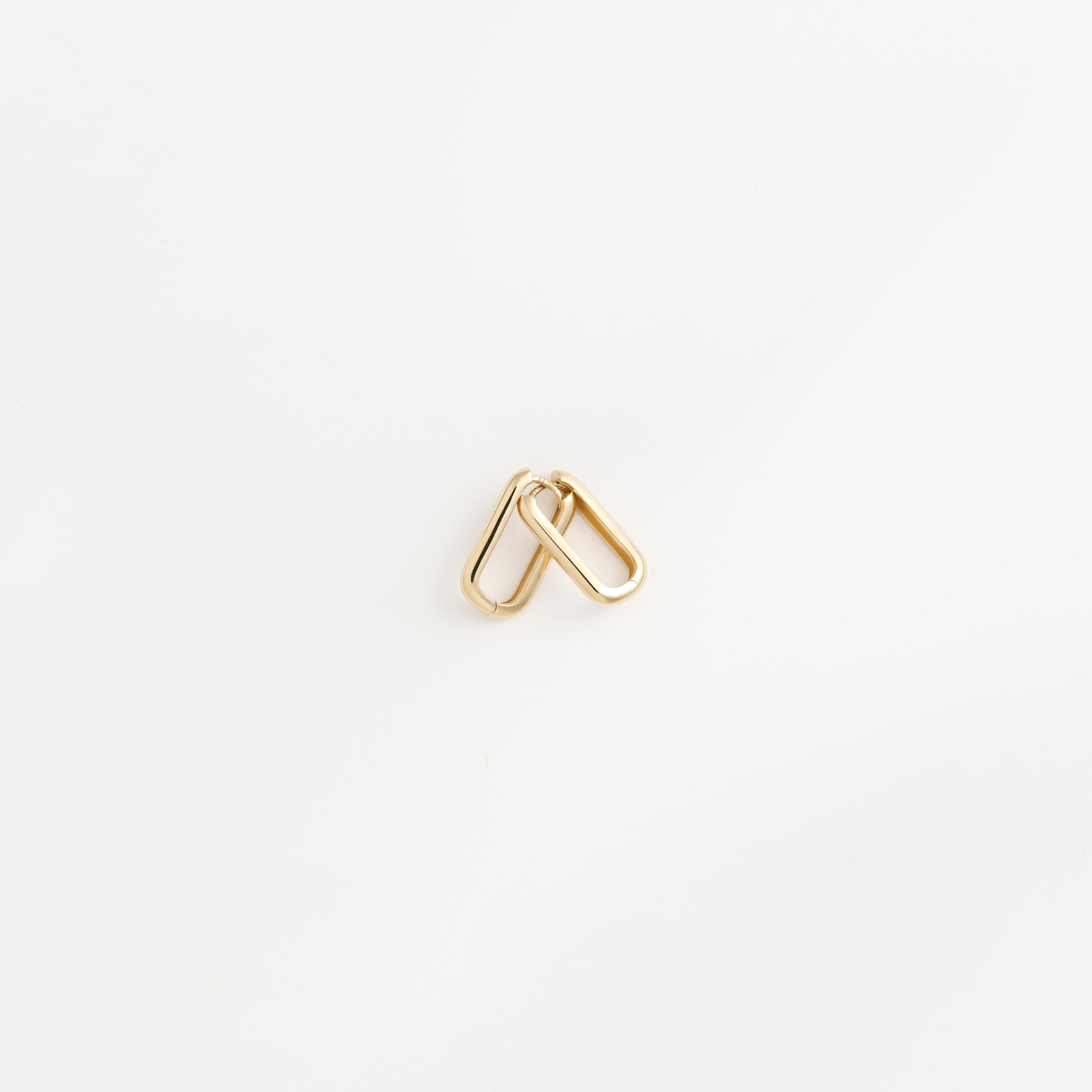 Hand-polished 14k gold Large Leanea earrings by Zaerine, featuring a sleek silhouette and crafted to last a lifetime.
